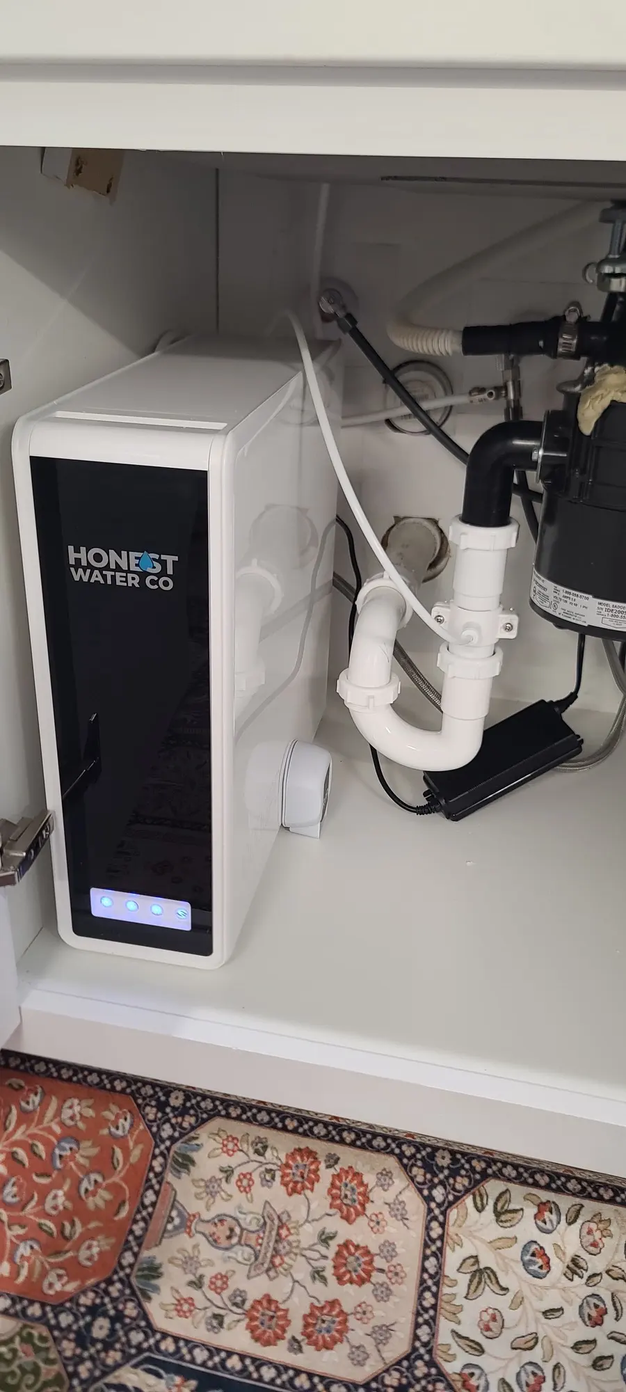 Honest Water Co under-sink reverse osmosis unit installed in a kitchen cabinet