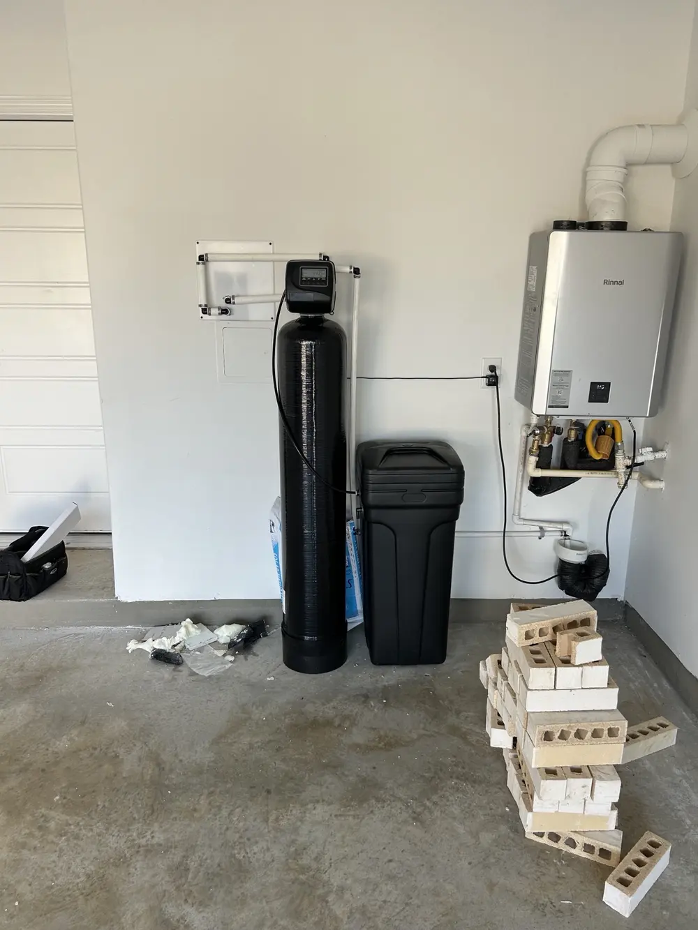 Softener and brine tank installed beside a Rinnai tankless water heater