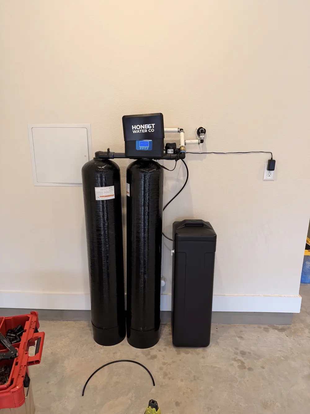 Twin-tank system with digital control head and brine tank in a finished garage